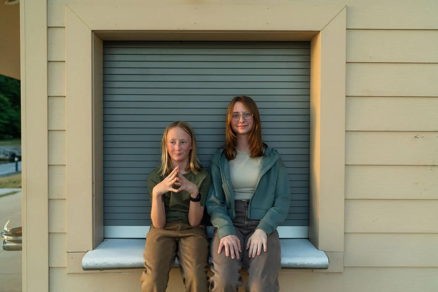 The Hamann kids against the sage shutter, by Studio Y, Cedar Rapids family photographer